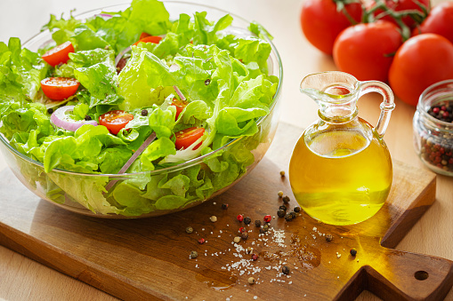 Extra virgin olive oil and fresh lettuce salad