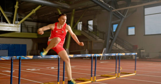 istock Young woman running on track 1809495134