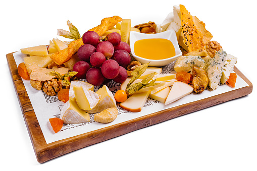 various types of cheese with fruits