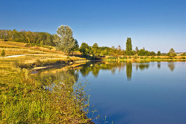 istock Blue lake and green landscape 180950358