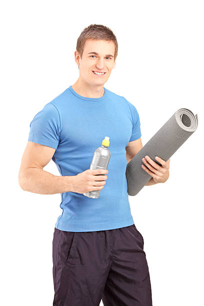 istock Male holding a bottle of refreshment drink after exercise 180950401