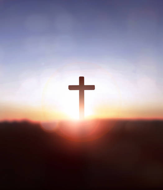 istock Silhouette jesus christ cross on sunrise background 1809512107
