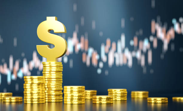 istock Dollar Sign On Top Of Coin Stacks Before Blue Financial Graph 1809517392