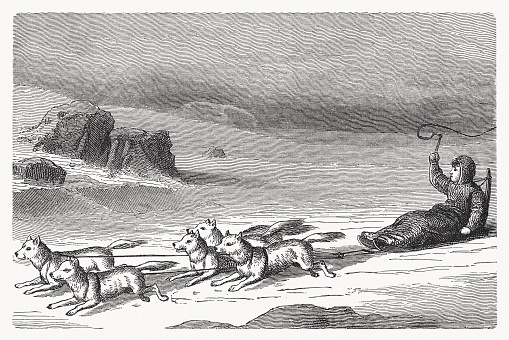 Eskimo with dog sled in the Arctic region. Nostalgic scene from the past. Wood engraving, published in 1894.