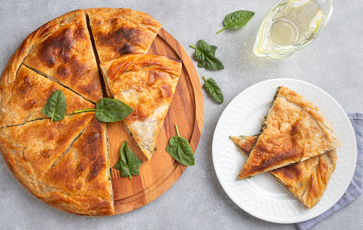 Spanakopita, greek phyllo pastry pie with spinach and feta cheese filling. Delicious handmade pies. Turkish name; el acmasi borek