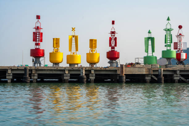 Buoy float sea floating coastal marine protect and indicate way for ship around harbor dock.