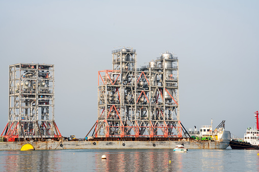 Big Construction on ship. Tender Drilling Oil Rig on Barge Ship transportation Rid to Oil Rig