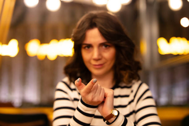 Two young woman speak in sign language