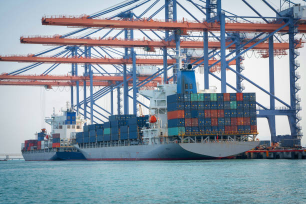 istock crane loading cargo container from truck to container ship in the international terminal logistic sea port concept freight shipping by ship, webinar banner forwarder mast. 1809547125