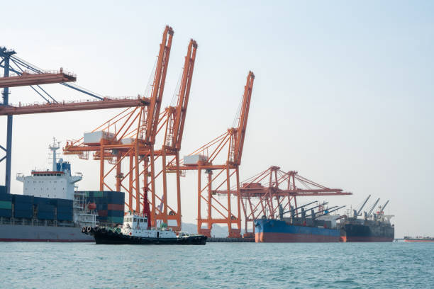istock crane loading cargo container from truck to container ship in the international terminal logistic sea port concept freight shipping by ship, webinar banner forwarder mast. 1809549944