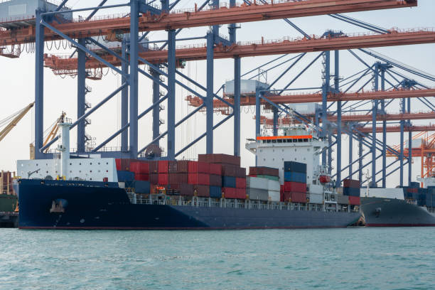 istock crane loading cargo container from truck to container ship in the international terminal logistic sea port concept freight shipping by ship, webinar banner forwarder mast. 1809551904