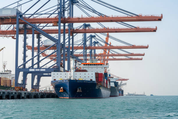 istock crane loading cargo container from truck to container ship in the international terminal logistic sea port concept freight shipping by ship, webinar banner forwarder mast. 1809551905