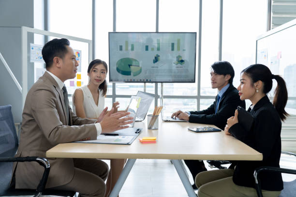 istock Asian Business People Discuss Project in Conference Room 1809554351