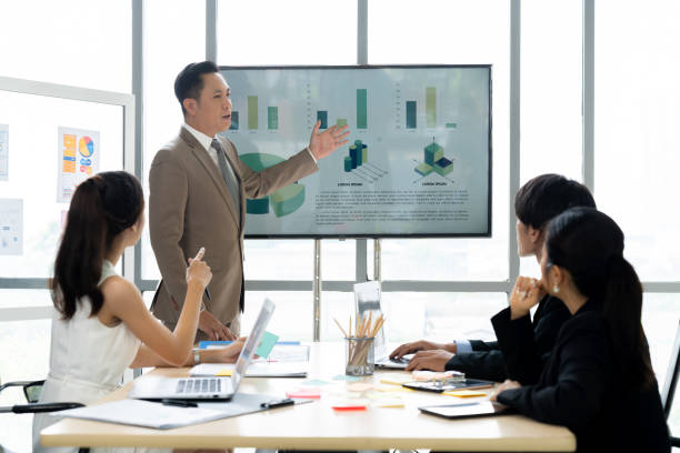 istock Asian Business People Discuss Project in Conference Room 1809554387