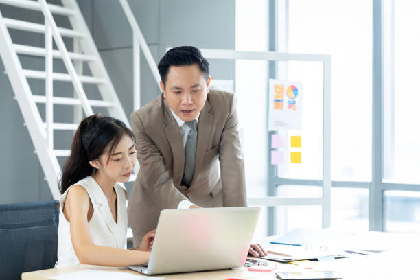 istock Confident Boss Gives Instructions to Secretary in Office 1809555007
