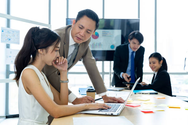 istock Corporate Employees Working Together in Conference Room 1809555019