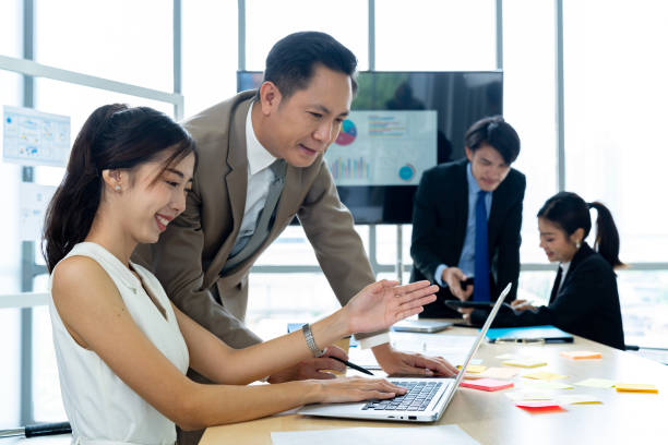 Corporate Employees Working Together in Conference Room