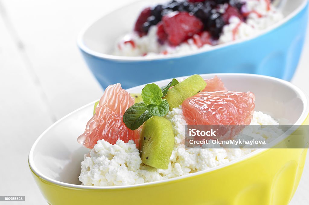 Cottage cheese with kiwi and grapefruit Cottage cheese in bowl with kiwi grapefruit and mint Bowl Stock Photo