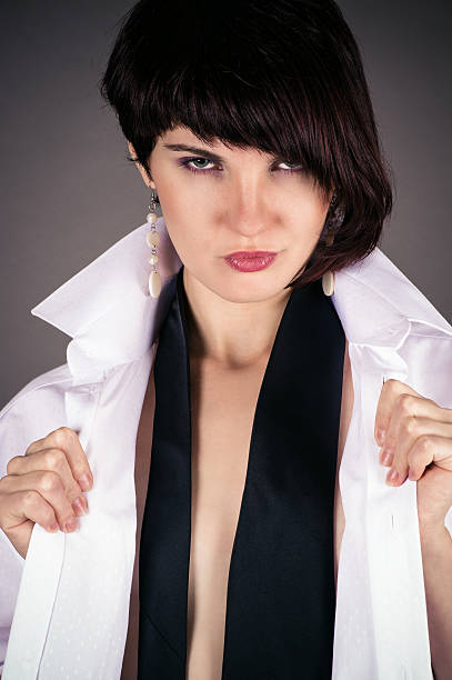 istock seductive woman in a man's shirt 180957299