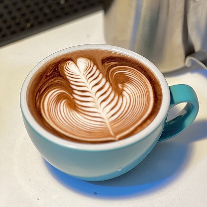 Latte art rosetta pattern in a cup