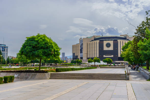 Sofia, Bulgaria - September 14, 2023: View of the National Palace of Culture (NDK) with its garden and fountain, Locals and Visitors, in Sofia, Bulgaria