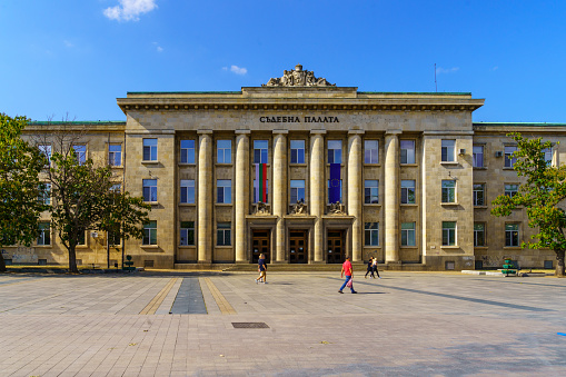 Ruse, Bulgaria - September 17, 2023: View of the Courthouse building, with locals and visitors, in Ruse, northeastern Bulgaria