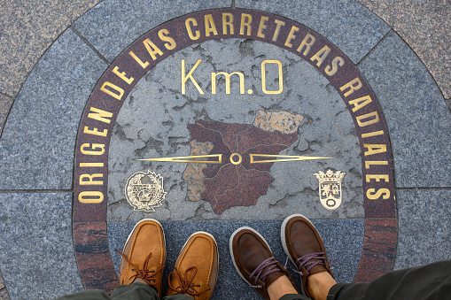 Madrid, Spain - Oct 27, 2023: The Kilometre Zero is a popular spot among tourists in the Puerta del Sol plaza.