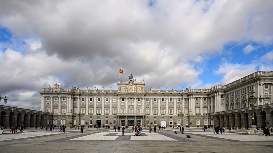 Madrid, Spain - Oct 28, 2023: The Royal Palace of Madrid , or  Palacio Real de Madrid, under cloudy sky.