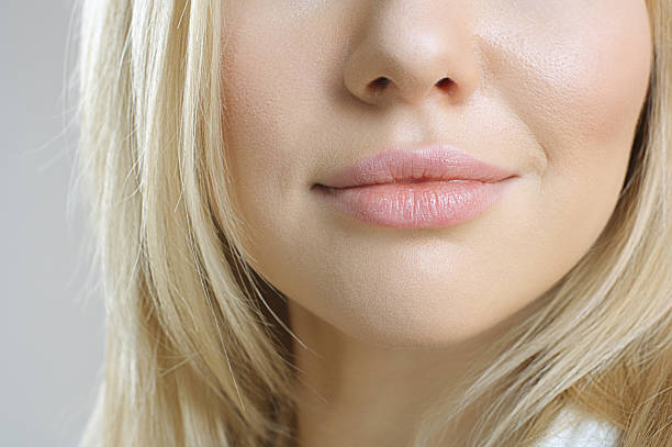 istock Young woman with beautiful lips 180960584