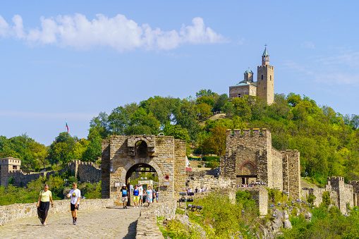 Veliko Tarnovo, Bulgaria - September 23, 2023: View of the Tsarevets fortress, with visitors, in Veliko Tarnovo, Bulgaria