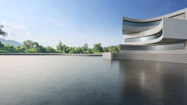 istock Abstract architecture design of modern building. Empty parking area concrete floor with blue sky. 1809615373