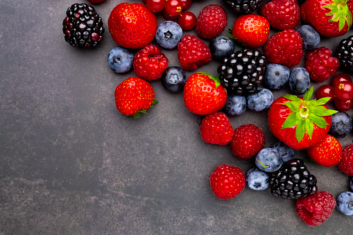 Berries Background. Strawberries, Blueberry, Raspberries, and Blackberry.