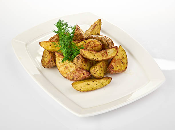 istock Fried potato wedges isolated on white background 180962698