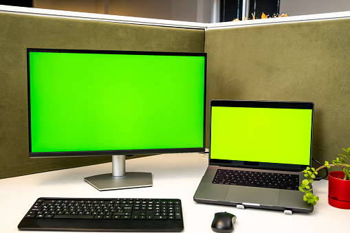 Moving Shot of the Green Mock-up Screen Digital Tablet Computer Standing on a Desk in Landscape Mode. In the Background Depth of Field Cozy Living Room.