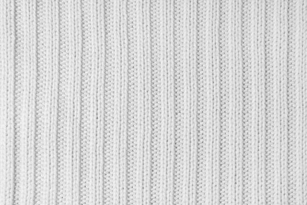 istock Jersey textile background , white striped knitted fabric, cloth surface 1809640587