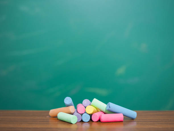 istock Multicolor chalk on wooden with backboard for education background 1809646945