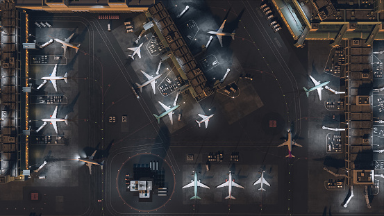 Aerial View of a 3D Commercial Airport Render with Airplanes, Passenger Terminals, Runway and Service Machinery. Top Down View of Modern VFX Aircrafts Moving in International Port in the Evening.