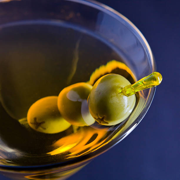martini with green olives