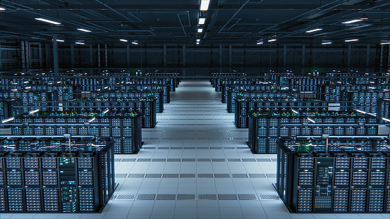 Modern Data Technology Center Server Racks Working in Well-Lighted Room. Concept of Internet of Things, Big Data Protection, Storage, Cryptocurrency Farm, Cloud Computing. Mining Facility Warehouse.