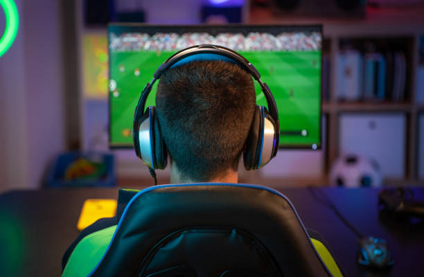 istock Unrecognizable young man playing sport games on computer at home. 1809664979