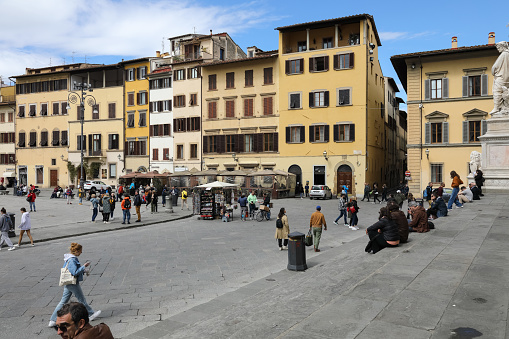 Florence, Italy - April 14, 2023: General view of Piazza Santa Croce. Historic buildings in the old town create the picturesque urban landscape of this wonderful city.