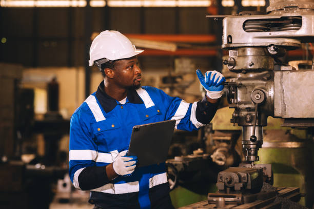 istock Production engineers are assisting adjusting and maintaining factory machine, Male workers technician examining control the industrial technology tool, professional repair men work in industry plant 1809688711