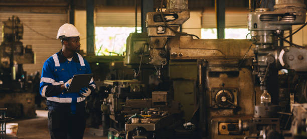 istock Production engineers are assisting adjusting and maintaining factory machine, Male workers technician examining control the industrial technology tool, professional repair men work in industry plant 1809689298