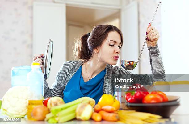 Young Woman Tests Food Stock Photo - Download Image Now - Beautiful Woman, Soup, 20-24 Years