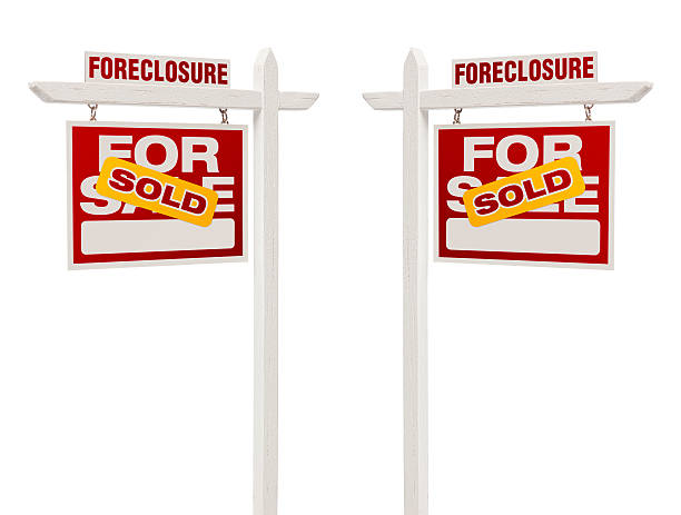istock Two Foreclosure Sold For Sale Real Estate Signs, Clipping Path 180969113