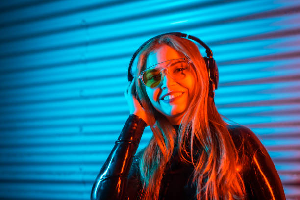 istock Smiley disc jockey using headphones in an urban space 1809717825