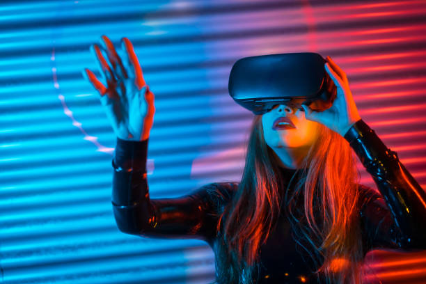 istock Woman using Virtual reality goggles in a futuristic space 1809724390