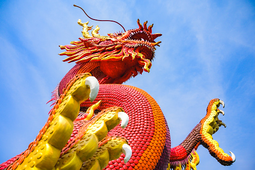 Red dragon statue with blue sky, Nakhon Sawan province.