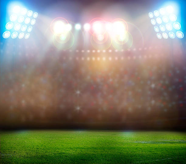 istock Spotlights shining down on a football game 180972526