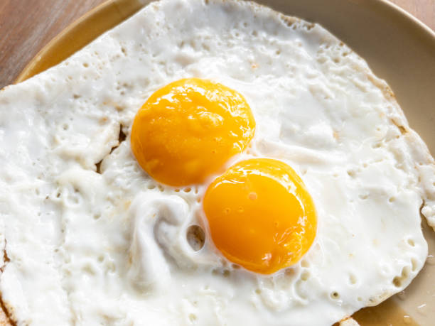 istock Closeup of the twin fried eggs 1809731109